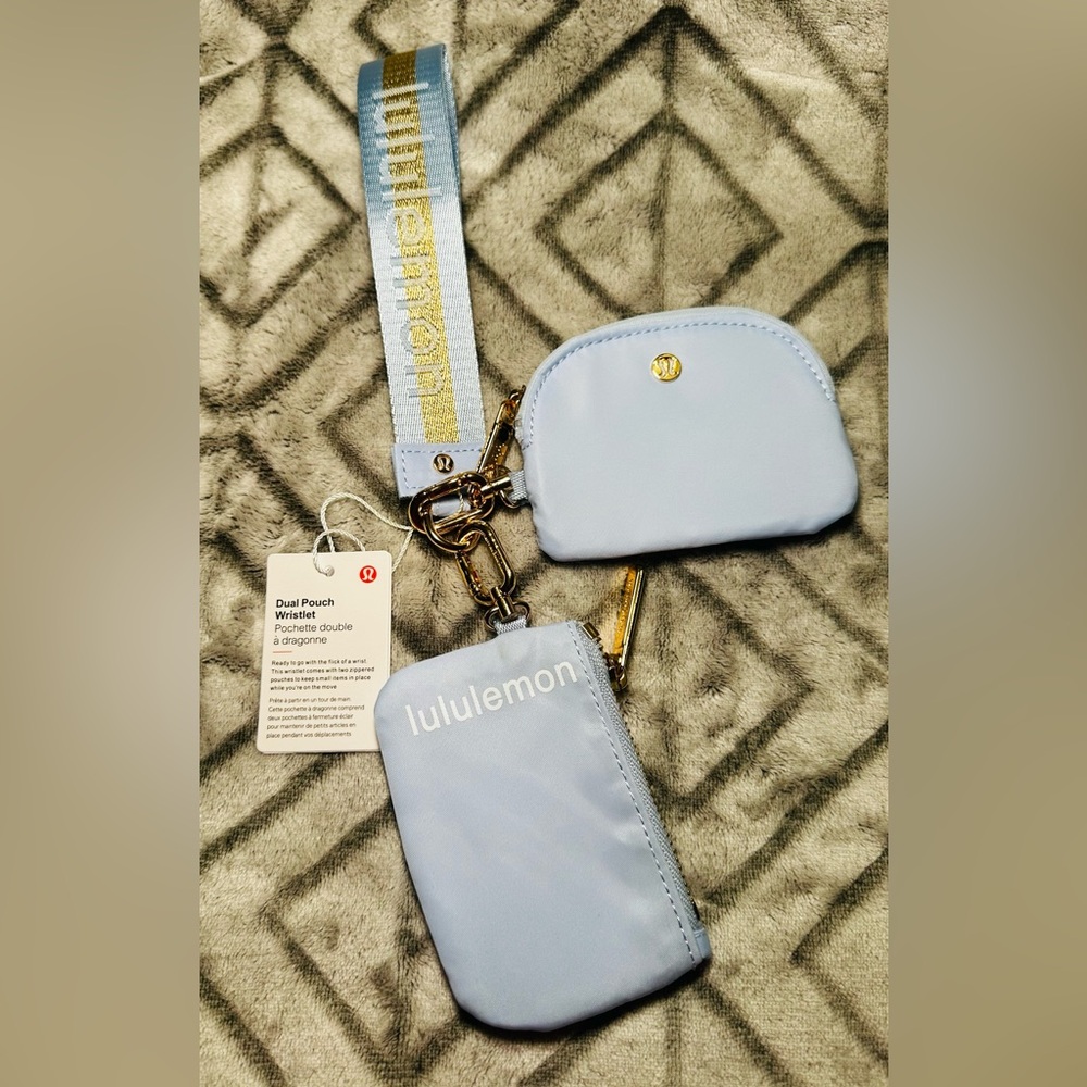 lululemon light blue dual pouch wristlet with gold hardware